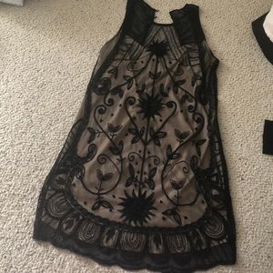 Dress with detailed overlay